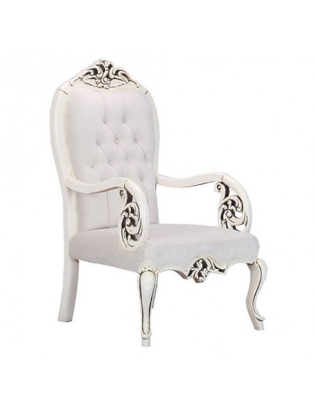 white wooden carved armchair
