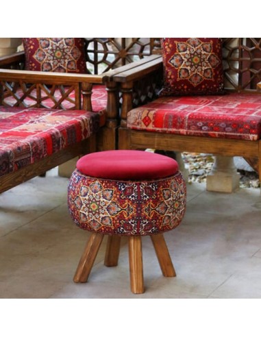 red ottoman with brown legs