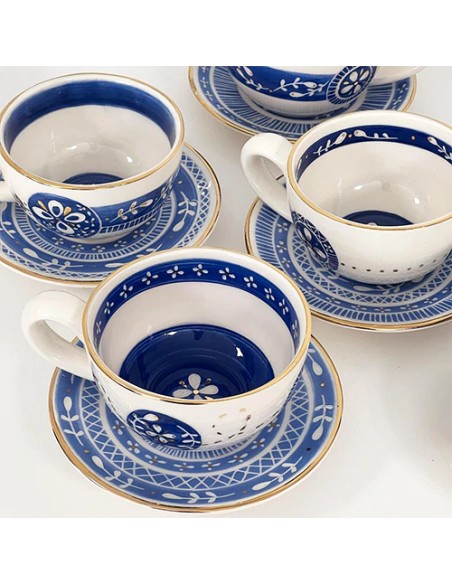 blue tea cup and saucers