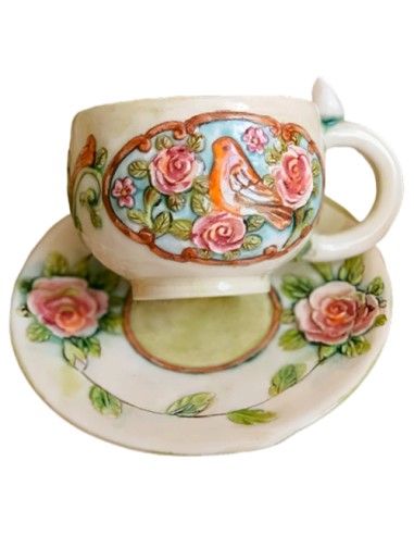 teacup with embossed motifs