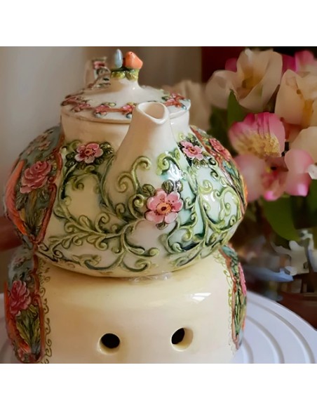 handmade teapot with embossed motifs