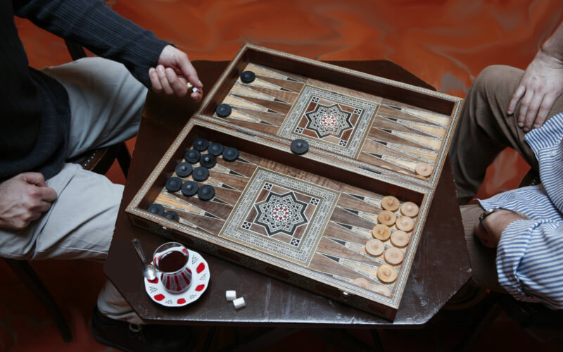 playing backgammon as a house party game for adults