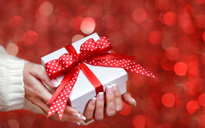Christmas means 'giving,' and the gift without the giver... | Picture Quotes