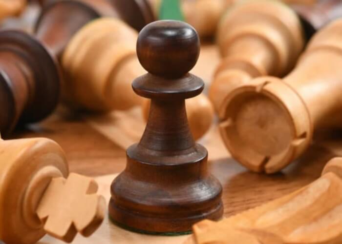 dark pawn in a chess layout