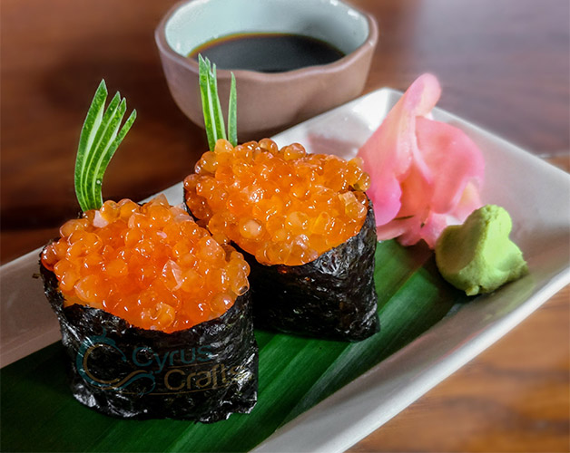 Salmon roe or ikura in sushi roll
