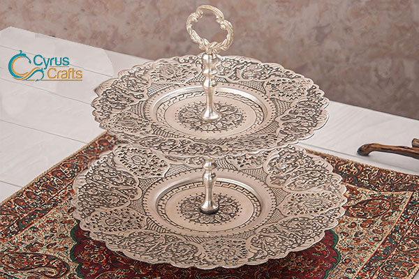Cake stand of brass with silver coating made from hand engraving technique