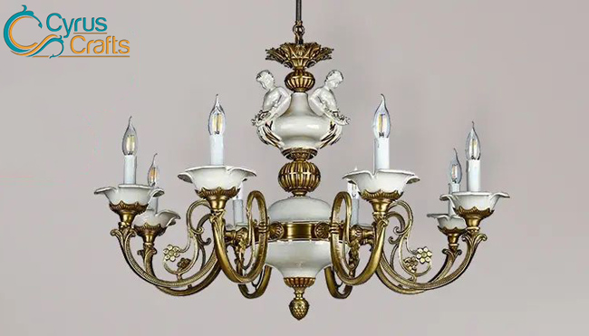 brass chandelier light with ceramic sculpture